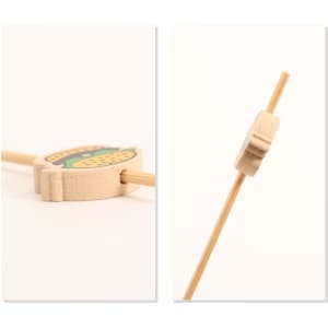 A bamboo skewer with a decorative wooden topper, featuring vibrant colours and a logo. Ideal for cocktail presentation.