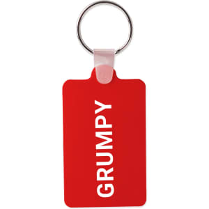 A red rectangular keyring with a silver metal ring and a branding logo. The keyring features the word "GRUMPY".