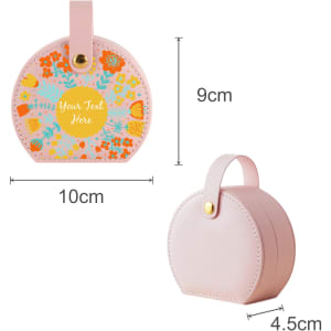 A small portable pink PU leather jewellery box with a floral design and a handle, measuring 9cm by 10cm.