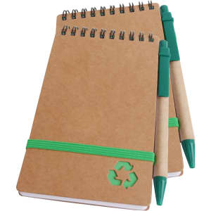 A brown spiral notebook with a green elastic band and two green ballpoint pens, featuring a recycling logo.