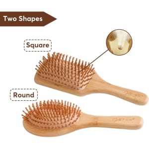 A bamboo hairbrush with round and square shapes, featuring wooden bristles and a natural finish. It has a branding logo.