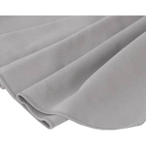 A grey Quick Dry Towel with soft, smooth texture, featuring a rounded edge and a small logo.