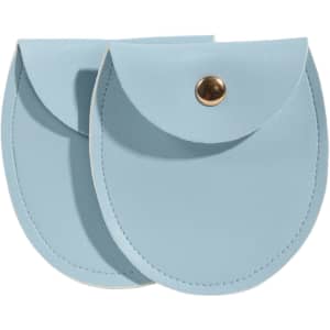 A light blue oval PU leather jewelry pouch with a snap closure, featuring a gold-toned button.