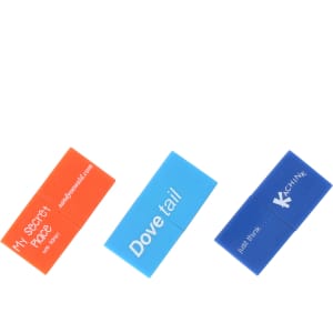 Three brick-shaped flash drives in orange, blue, and dark blue, featuring various logos and branding.