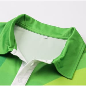 A close-up of a green and white unisex polo shirt, featuring a collar and a logo.