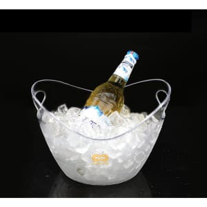 A clear ice bucket filled with ice and a bottle resting on top, featuring a handle for easy carrying.
