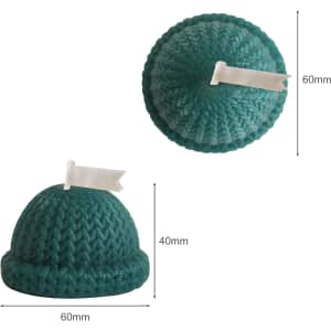 Hat-shaped candles in teal, featuring a textured knit design and a decorative white flag on top.