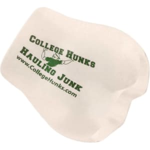A white stress reliever shaped like a unique object with green branding.