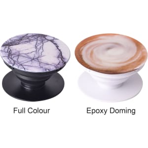 Two phone pop holders in different designs: one with a marbled pattern on a black base and the other featuring a swirled pattern on a white base.