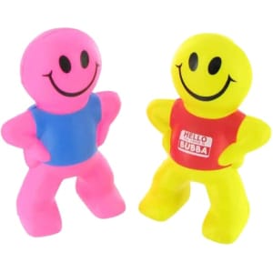 Two stress relievers shaped like smiling figures, one pink with a blue shirt, and the other yellow with a red shirt.