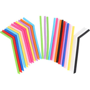 A collection of reusable silicone straws in various colours, including pink, blue, green, yellow, and black, arranged in a fan shape.