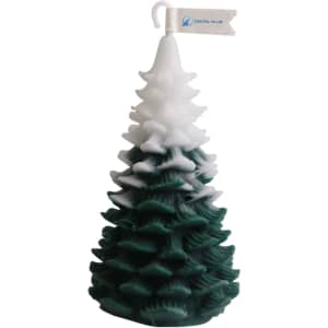 A green and white candle shaped like a Christmas tree, featuring a decorative logo flag at the top.