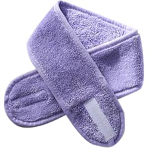 A purple promotional headband made of soft material, featuring a logo and designed for headwear.