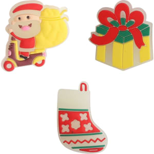 Three colourful clog shoe charms featuring a Santa character, a gift box, and a Christmas stocking.