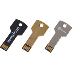 Three square key flash drives in black, gold, and silver with branding logos.