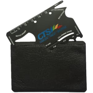 A card-sized multi-tool in black, featuring a ruler, bottle opener, and phone stand, displayed in a black holder.