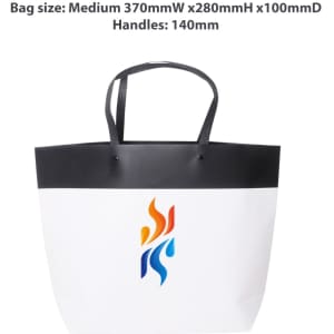 A medium black and white boutique paper bag with handles, featuring a logo design in vibrant colours.