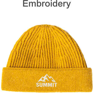 A round, yellow beanie with a ribbed design and a logo featuring mountains and text on the cuff.