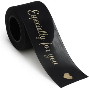 A roll of black organza ribbon featuring gold text that reads "Especially for you" and a heart design.