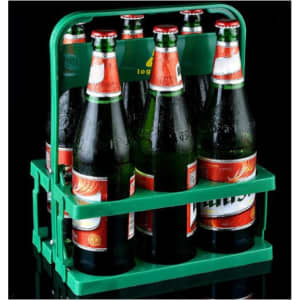 A foldable green beer basket holding several bottles of beer with a handle on top.