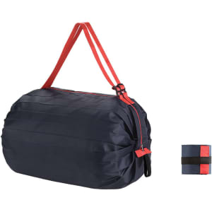 A foldable shopping shoulder bag in navy blue with red straps, featuring a compact foldable design.
