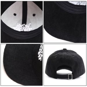 A black corduroy baseball cap featuring a flat brim and adjustable strap at the back, with an interior lining.