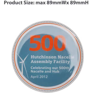A circular promotional pin featuring a blue background with the number "500" in orange, and a logo.