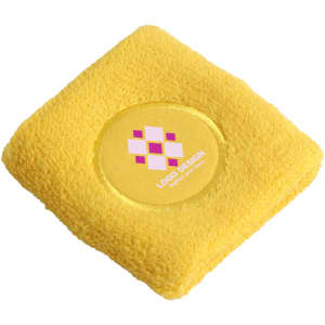 A yellow Terry sport wristband with a circular logo design in the centre.
