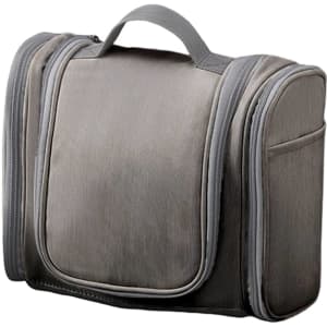 A grey storage bag with zippers and a handle, featuring multiple compartments and a sleek design.