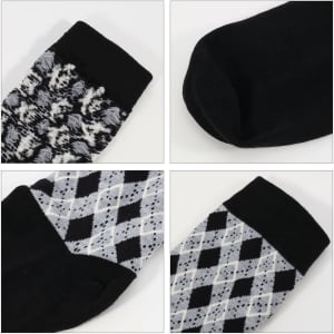 Four pairs of socks featuring different patterns, including a black and white design and an argyle pattern, with black sections.
