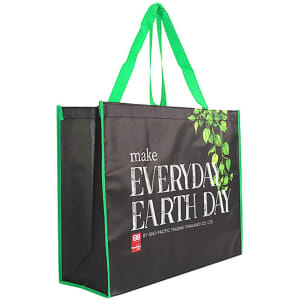 A black laminated non-woven trade show bag with green accents and a leafy design. Features sturdy handles and logo branding.
