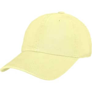 A premium washed cotton baseball cap in a soft yellow colour, featuring an adjustable strap and a logo.