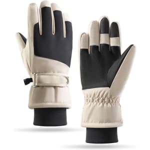 Ski gloves in beige and black, featuring a textured grip and elastic wrist for a snug fit. The gloves have a logo.