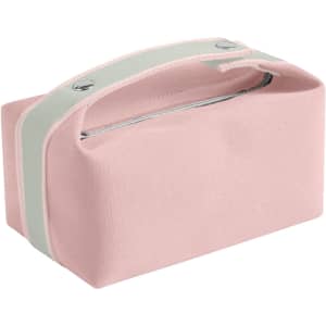 A pink portable canvas cosmetic bag with a grey handle and silver zipper. Features a simple design and a brand logo.