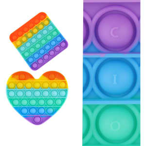 A rainbow-coloured Pop It fidget toy in square and heart shapes, featuring a playful design and a logo.