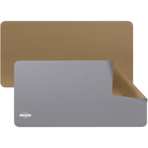 A PU leather desk mat featuring a grey side and a brown side, with a logo present on the grey side.