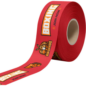 A roll of red promotional ribbon featuring boxing-themed graphics and a logo.
