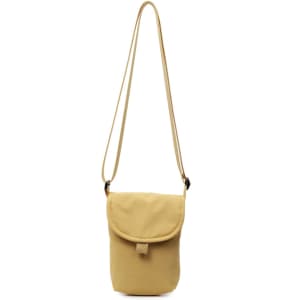 A small size canvas shoulder bag in a warm yellow hue, featuring a flap closure and an adjustable strap.