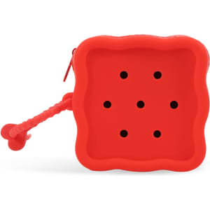 A red square silicone pouch with six holes and a textured handle, featuring a logo on the side.