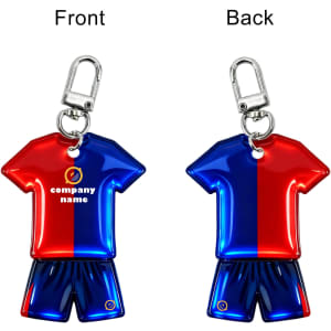 A reflective keychain in the shape of a blue and red sports shirt with matching shorts, featuring a logo.
