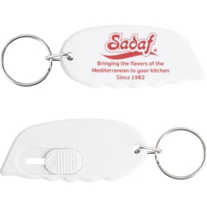 A white keyring in the shape of a mini cutter with a keychain attachment. It features a logo.