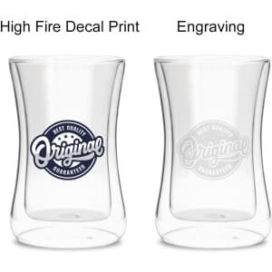 A drink bottle featuring a double wall design, clear glass, with a logo on the side. One version has decal print and the other engraving.