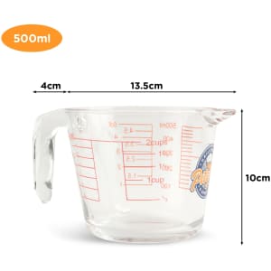 A clear glass baking measuring jug with graduated markings and a logo, holding up to 500ml.