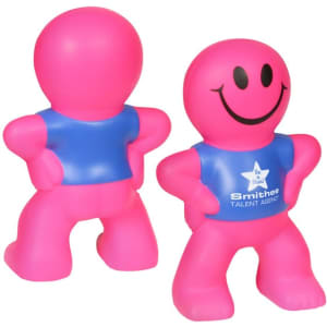 A pink stress reliever in the shape of a smiling humanoid figure with a blue shirt and a logo.