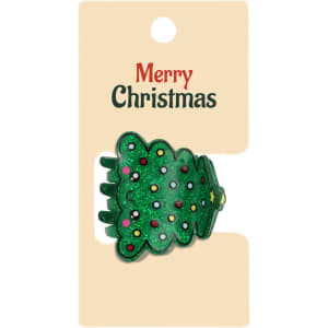 A green Christmas tree hair claw with colourful decorations, presented on a cardboard backing with a logo.
