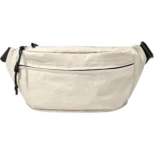 A large beige bum bag with a front zipper pocket and adjustable straps, featuring a logo.