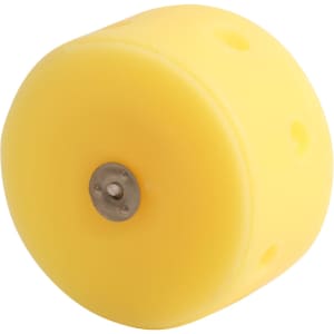 A round yellow candle shaped like cheese, featuring a metal base and several holes.