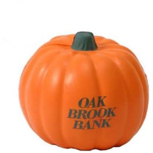 An orange pumpkin-shaped stress reliever with a green stem and a logo on the side.