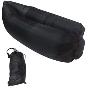 An inflatable lazy bed in black, folded and stored in a matching black carry bag.