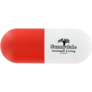 A capsule-shaped stress reliever in red and white, featuring a logo on the surface.